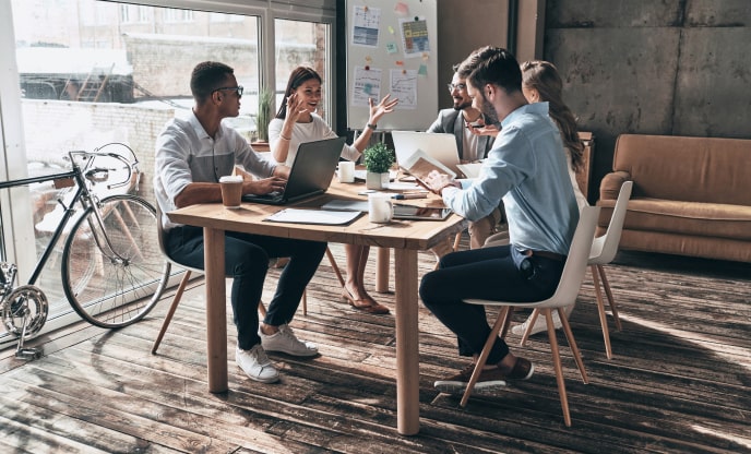 A team meeting to discuss search engine optimization company Ad Copy & Creative Development process